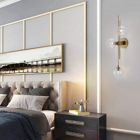 Three Light Modern Wall Sconce With Clear Glass Globe And Gold Base For Bedside Or Living Room Sleek Gold Wall Lamp Delivers Warm Ambient Glow And Contemporary Decor