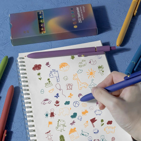 Person drawing with Colorful Gel Pen Set, 6 Pack Fine Point 0.5mm Colored Ink Pens For Journaling, on notebook with doodles.
