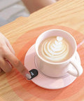 Compact Desk Coffee Warmer With Auto Shut Off And Waterproof Aluminum Base keeps coffee steaming, featuring sleek design and touch control.