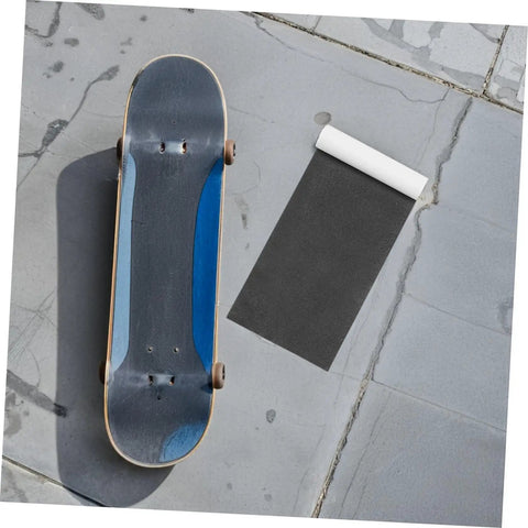 Skateboard beside Two Pack High Grip Sandpaper Traction Tape for Skateboards and Scooters 84x23cm Waterproof Anti Slip Deck Tape