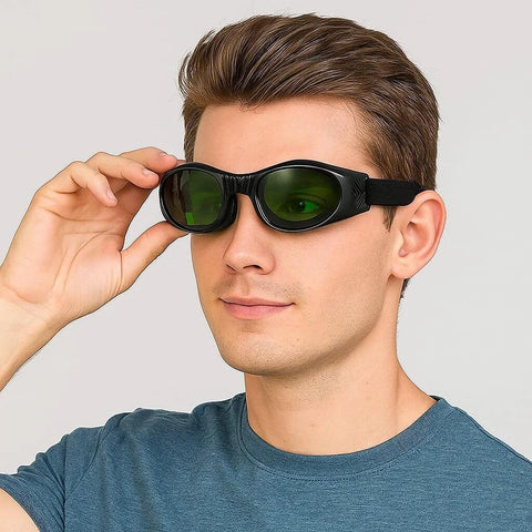 Dubofu laser safety glasses, black frame with green lenses, front view.