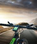 Bicycle with GPS device on road at sunrise, showcasing Gear Up With This 4 Pack Bike Mount Replacement Inserts for Out Front Cycling