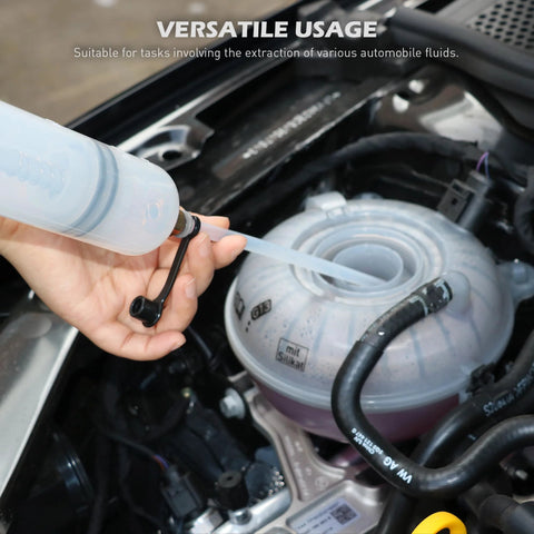 Side view of SEDY 500CC fluid extractor oil syringe; transparent blue manual suction pump with tube near car reservoir.