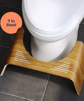 Teak Wood Toilet Stool Slim 7 Inch Height For Natural Pooping Position Upgrade positioned under white toilet on bathroom floor