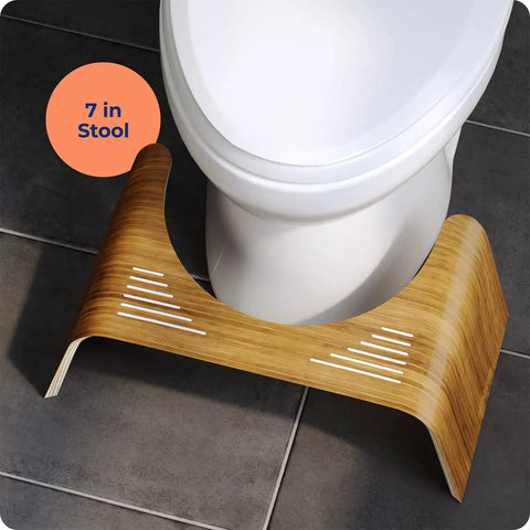 Teak Wood Toilet Stool Slim 7 Inch Height For Natural Pooping Position Upgrade positioned under white toilet on bathroom floor