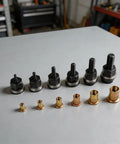 Heavy Duty Carbon Steel Replacement Rivet Nut Mandrels, Six Piece Set For M3 To M10 Manual Hand Riveter Tools displayed on a workbench.