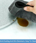 Heavy Duty Glass Lazy Susan Rotating Tray with 9mm thick tempered glass being cleaned, showing anti-fouling features