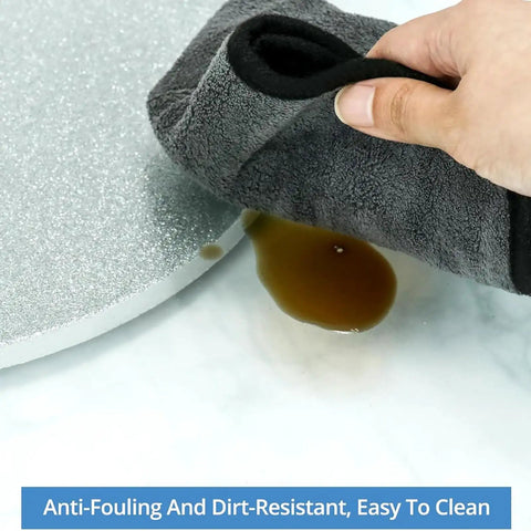 Heavy Duty Glass Lazy Susan Rotating Tray with 9mm thick tempered glass being cleaned, showing anti-fouling features