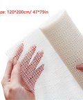 Close-up of hands holding 47x79 inch Non Slip Rug Pad, PVC heavy-duty gripper mat for tile wood shag floors, breathable anti-slip underlay.