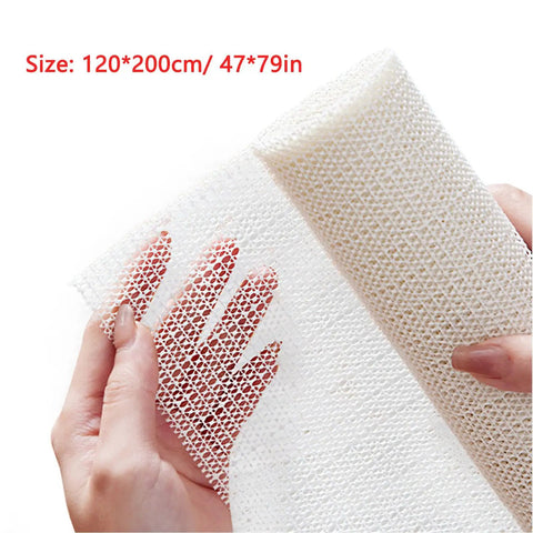 Close-up of hands holding 47x79 inch Non Slip Rug Pad, PVC heavy-duty gripper mat for tile wood shag floors, breathable anti-slip underlay.