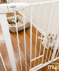 Extra Tall Walk Thru Pet Gate For Large Dogs With Adjustable Pass Through Door pressure mounted safety barrier in a home setting.