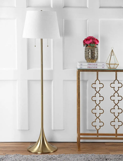 63 Inch Brass Gold Modern Glam LED Floor Lamp With White Linen Empire Shade next to decorative console in living room
