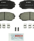 Bosch BC1258 ceramic brake pad set, front view with two pads, retaining clips, and lubricant packet