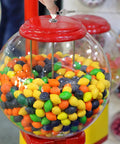 Gumball Machine Lock And Keys Set With Tubular Security Assembly For Candy Dispensers Keeps Thieves Out Fits Most Vending Machines Easy Install Top Cover Includes 2 Keys For Quick Access being used on a gumball machine