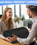 Under Desk Foot Rest Ergonomic Foot Stool With Three Adjustable Heights And Washable Cover presented as a gift on a table