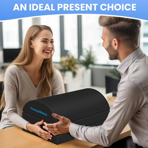 Under Desk Foot Rest Ergonomic Foot Stool With Three Adjustable Heights And Washable Cover presented as a gift on a table