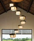 Killer Large Bamboo Ceiling Pendant Light With Eight Warm Hanging Fixtures For Staircases And Grand Foyers Adjustable Drop Wire in rustic setting.