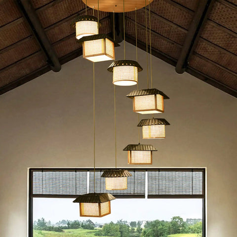 Large LED Bamboo Chandelier With 8 Bulbs For Staircases And Entryways Adjustable Pendant Light hanging in a high ceiling room.