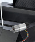 Top Shelf High Torque Metal Dc Micro Motor With Encoder mounted on equipment, showing metal casing and wiring.