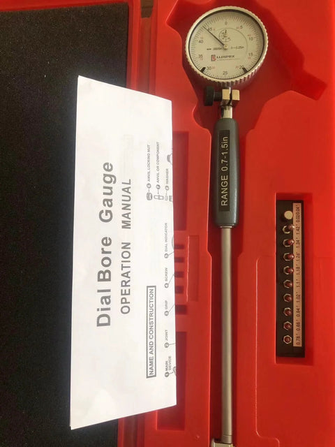 Front view of LLDSIMEX dial bore gauge set in red case, 0.7-1.5 in range with 0.0005 in graduations, manual included