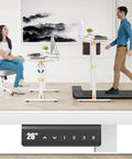 Electric Standing Desk With Four Memory Presets And No Sweat Height Adjustment In White, ergonomic design with user adjusting seated and standing positions.