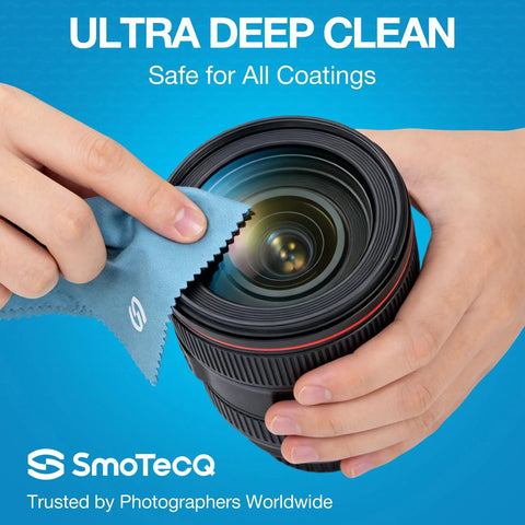 Hands cleaning a camera lens with Alcohol Free Glasses Cleaner Kit with Plant Based Microfiber Cloths and Pouch.