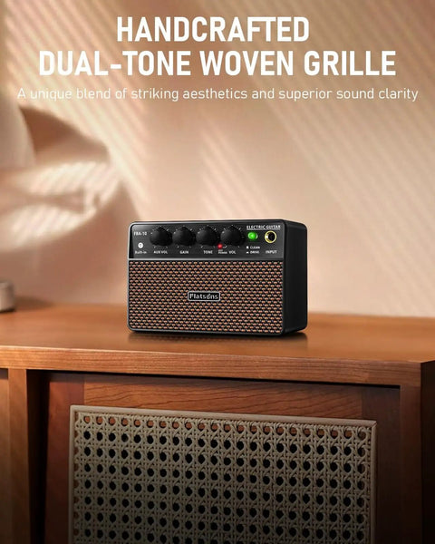 Compact 10W Guitar Amp With Clean And Drive Channel USB C Rechargeable Wireless Portable Practice Amp For Home And Travel Three Point Five Millimeter Headphone And Aux Jack Rich Analog Tone For Indoor Jams displayed on wooden table with woven grille design.