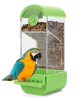 No Fuss Acrylic Automatic Bird Feeder With Sturdy Perch For Cage with colorful seeds and a macaw bird nearby.