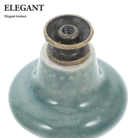 Close-up of knob from Six Piece Ceramic Cabinet Handles Set With Vintage Floral Pattern Round Knob Pulls In Celadon Blue For Kitchen Cabinets