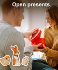 A man giving a woman a round red gift box while they sit on a couch, with cartoon animals and 'Open presents' text.