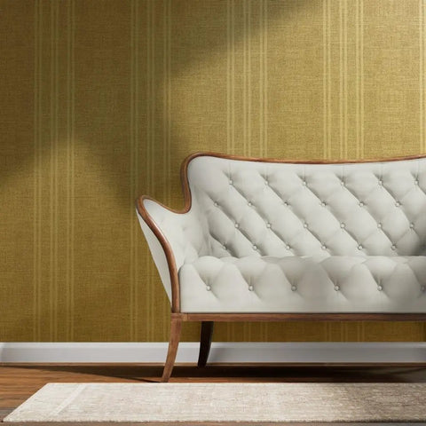 Top Tier Weathered Stripe Gold Metallic Wallpaper For Dope Indoor Walls Featuring Hella Stylish Fibrous Texture and Paste The Wall Application With Eco Friendly Pvc Free Class A Rated Finish That Adds Serious Swag To Any Room Setup applied to a stylish room with a cream sofa.