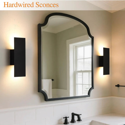 Oberade Single Hardwired Black LED Wall Light Bathroom Sconce 3000K Indoor beside a mirror in a modern bathroom setting.
