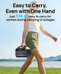 Woman carrying High Capacity Portable Power Station With 1200W Surge And 288Wh LiFePO4 Battery Solar Generator outdoors
