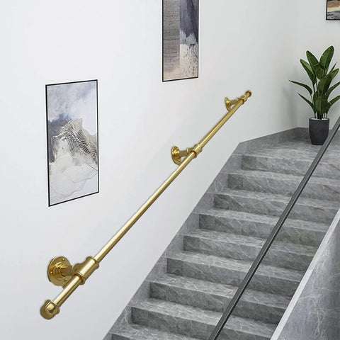 Hella Sturdy Gold Wrought Iron Handrail For Elderly And Kids Safety Stair Railing on gray stairs with wall art.