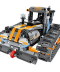 5 In 1 STEM Building Set With LED Lights And App Remote Control Toy Kit 554 Pieces To Build Robots Tanks Snowplows Cannons And More RC Car Racer And Sleigh Tracks For Kids Ages 6 7 8 9 10 11 12 And Up snowplow model with tracks and orange details.