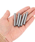 5/16 Inch Dowel Pins, 2 Inch Length, Heat Treated Alloy Steel For Extra Hardness, Bright Finish, shown in hand, five pins