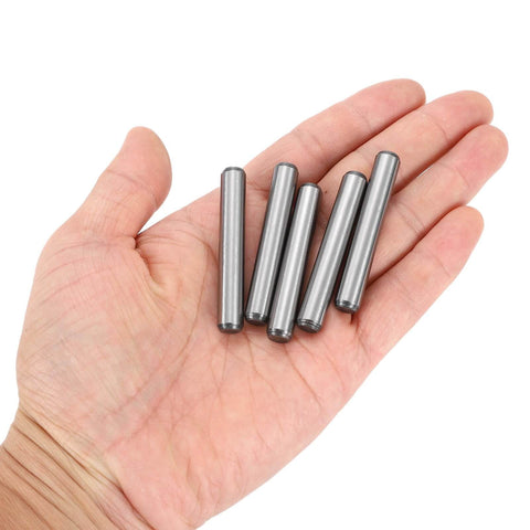 5/16 Inch Dowel Pins, 2 Inch Length, Heat Treated Alloy Steel For Extra Hardness, Bright Finish, shown in hand, five pins