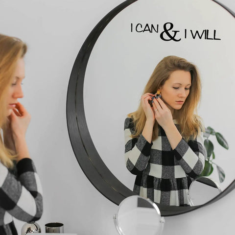 Woman looking in mirror with 'I Can & I Will' from Five Sheets Peel And Stick Vinyl Wall Decals With Seven Inspirational Quotes