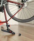 Rugged Aluminum Thru Axle Nut M15x1.5mm For Mountain Bikes And Electric Bikes near bicycle on wooden floor