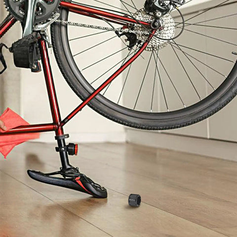 Rugged Aluminum Thru Axle Nut M15x1.5mm For Mountain Bikes And Electric Bikes near bicycle on wooden floor