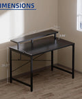 Compact 31.5 Inch Computer Desk With Monitor Stand And Headphone Hook For Small Spaces shown in corner of room, black.