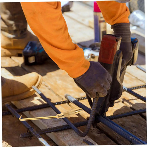 Portable Wire Tie Tool With Non Slip Handle For Quick And Easy Tying On Fences And Construction Sites in use on rebar.