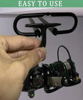 Person installing heavy duty metal fishing reel ceiling rack holds three reels
