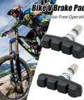 Mountain biker using Two Pairs V Brake Pads With Hex Nuts And Wrench For Mountain Bike Road Bike MTB And BMX Durable Rubber Pads For Quiet Long Lasting Braking Performance