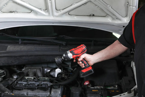 Mechanic using Dodge Axle Nut Socket One And Eleven Sixteenths Inch One Half Inch Drive Chrome Moly Impact Rated Heavy Duty