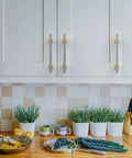 10 Pack 5 Inch Brushed Satin Nickel And Gold Cabinet Handles Set For Kitchen Cabinets And Cupboards, installed on white doors.