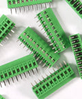 Green 10 Pack 10Pin 2.54mm 0.1 Inch Pitch PCB Screw Terminal Block Connectors scattered, showing pins and ABS plastic housing.