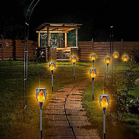 Garden path lit with Solar Torch Flame Lamp Extension Kit With Joint Connectors 6 Pack To Level Up Your Outdoor Lamps at night