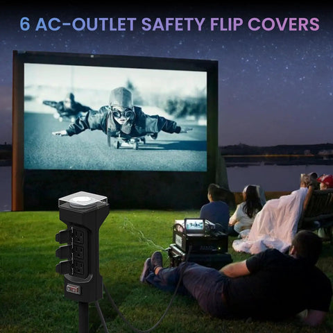 Slick 24 Hour Outdoor Stake Timer Boasts 6 Outlets And 6 Ft Extension Cord powering outdoor movie setup on grass.