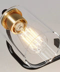 Close-up of 3 Light Vintage Bathroom Vanity Fixture Over Mirror Wall Sconces In Black Brass For Bath No Fuss Easy Install